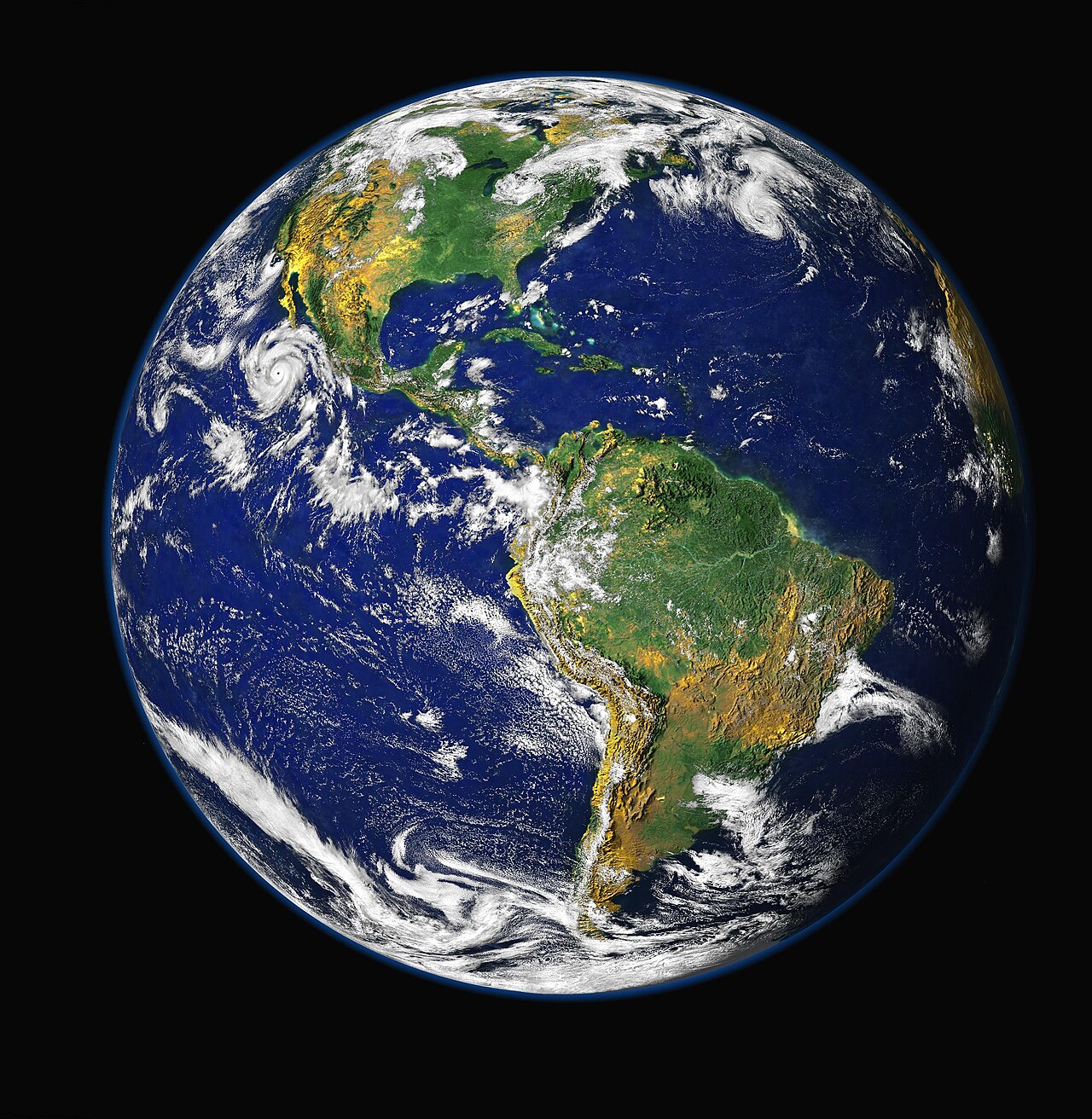 დედამიწის თითქმის წრიული დისკოს NASA Blue Marble კომპოზიტური გამოსახულება კოსმოსიდან, ჩანს ამერიკის კონტინენტები, ოკეანეები და ატმოსფეროს ღრუბლები